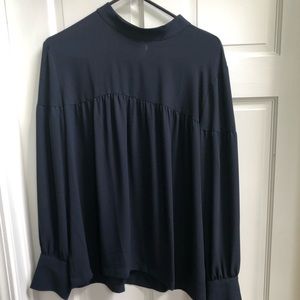 Navy blue, long sleeve shirt.